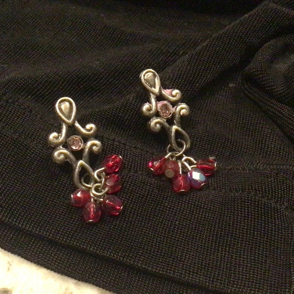 Vintage crystal center in aged silver with drops of red crystals. 1.25” drop